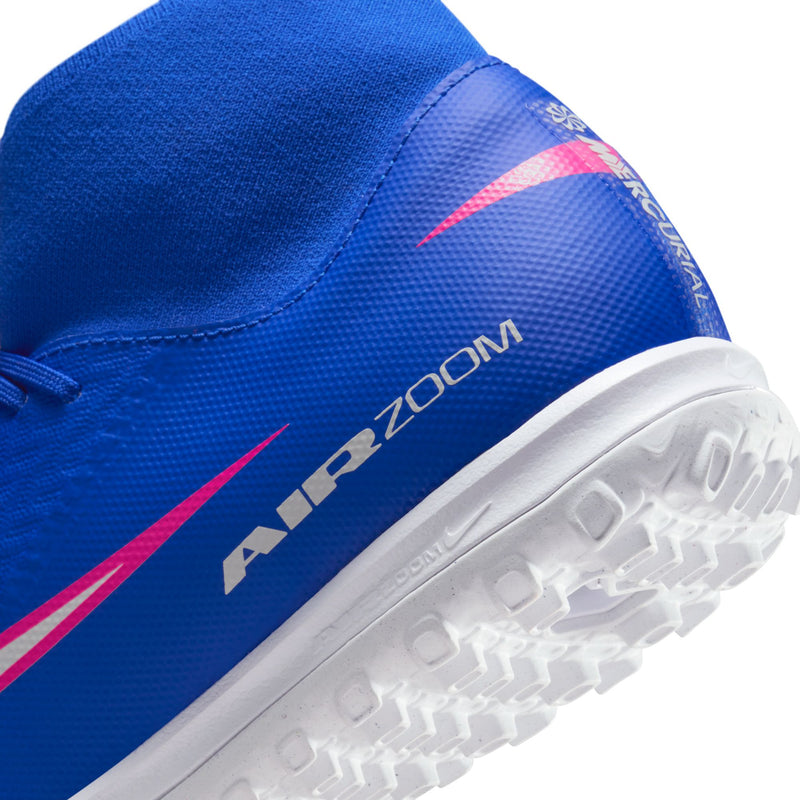 Close-up of blue TF soccer cleat side with Air Zoom text and pink trim on outsole