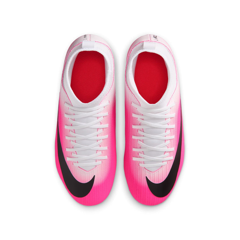 Pair of youth soccer cleats showing white laces, pink uppers, and black heel accents