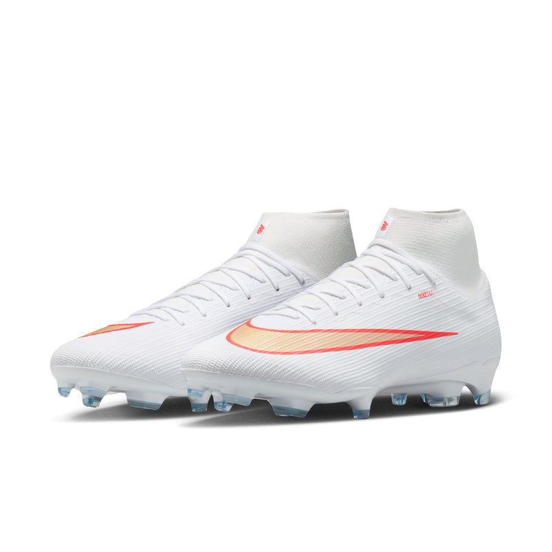 Men's white high-top soccer cleats with red swoosh accents and blue stud sole