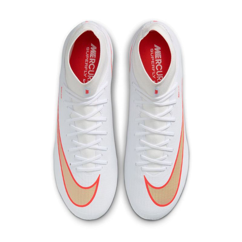 Pair of men's white soccer cleats showing red-lined laces and red Nike logo badges