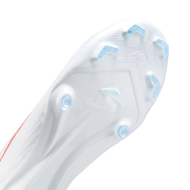 Close-up of white cleat plate with blue molded studs for firm ground grip