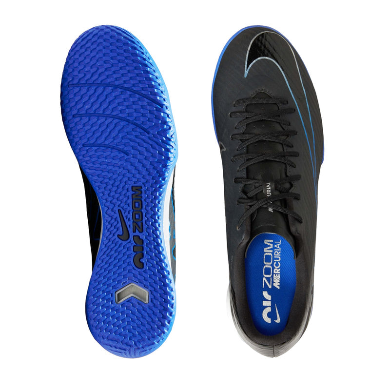 Pair of soccer shoe soles with blue rubber tread, side and top views