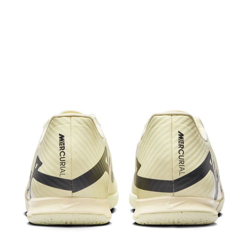 Men's cream soccer cleats rear view with black heel stripe and Mercurial text