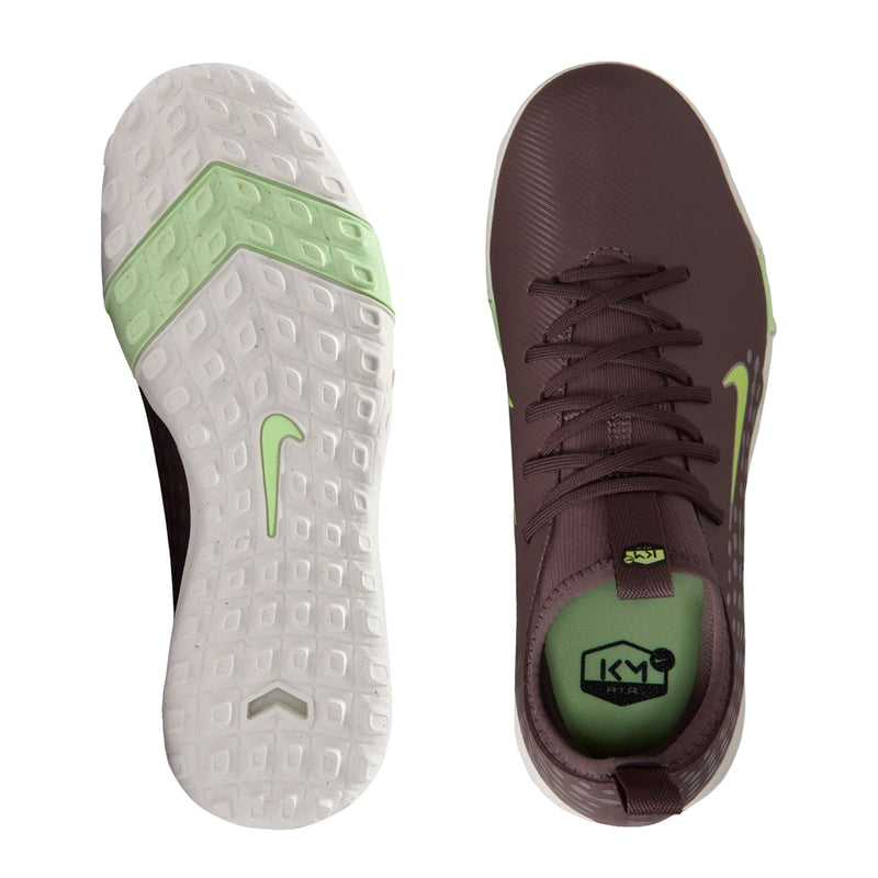 Youth plum soccer cleat shown with white outsole featuring light green traction details