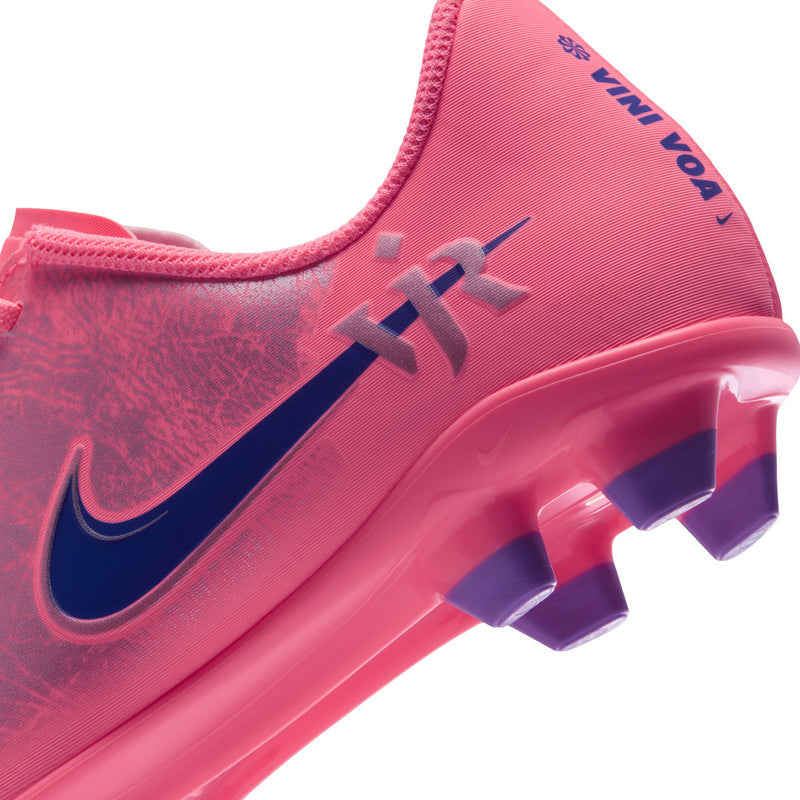 Youth soccer cleats toe and outsole, pink upper with navy swoosh and purple studs