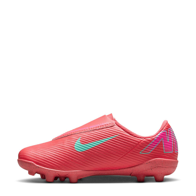 Kids red soccer cleat, teal swoosh and speed stripes, TPU studs on molded sole