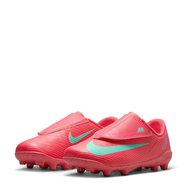 Kids red soccer cleat with teal swoosh and lace tab, molded TPU studs