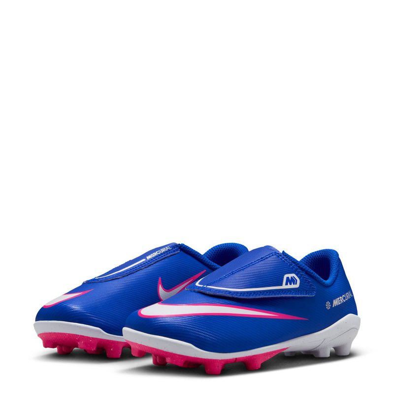 Pair of kids' blue soccer cleats with pink trim, white soles, and molded studs