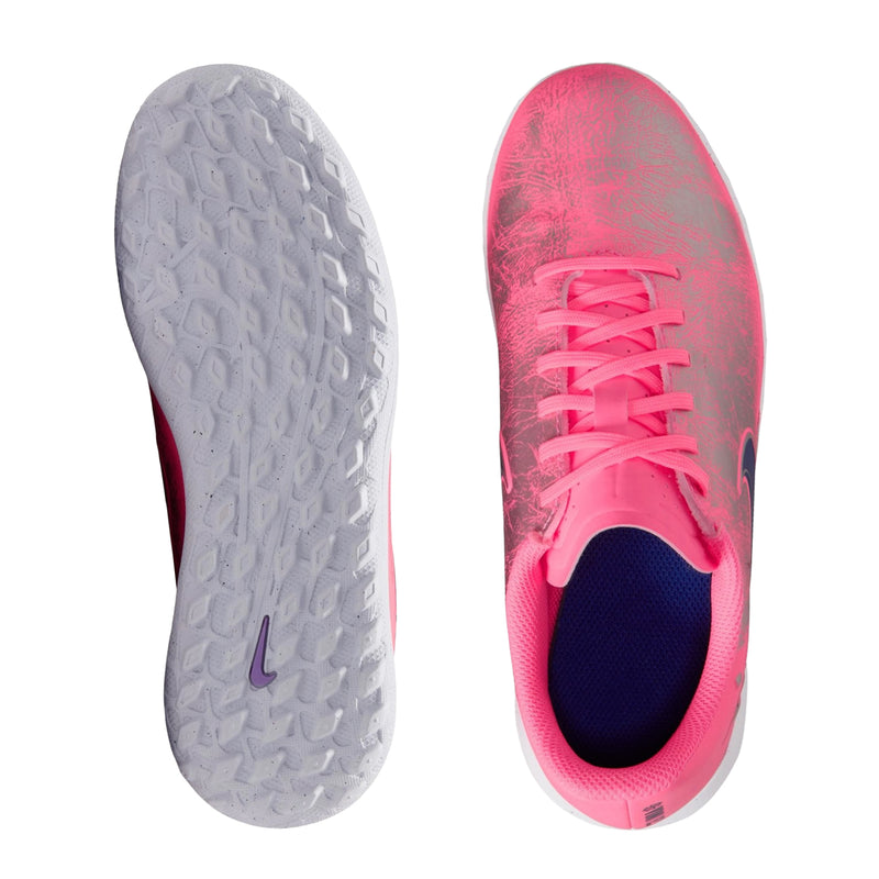 Youth soccer cleat soles view: textured gray outsole and pink top with dark blue interior.