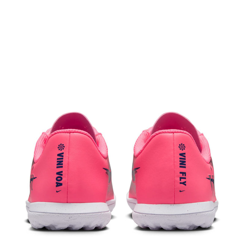 Youth turf soccer cleats back view with pink heels, white soles, and printed branding on heel.