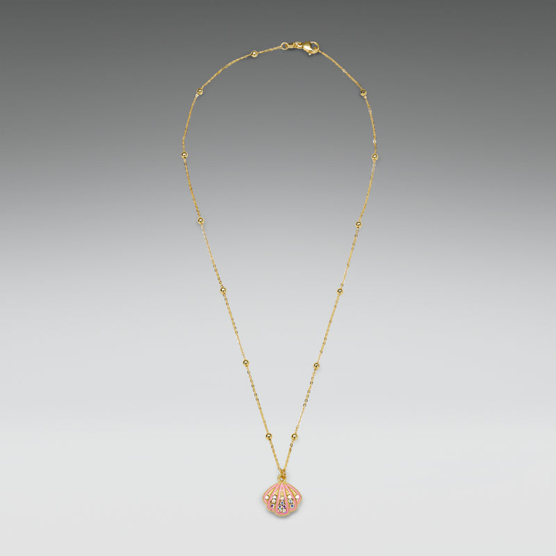 Gold necklace with a pink pendant on a gray background