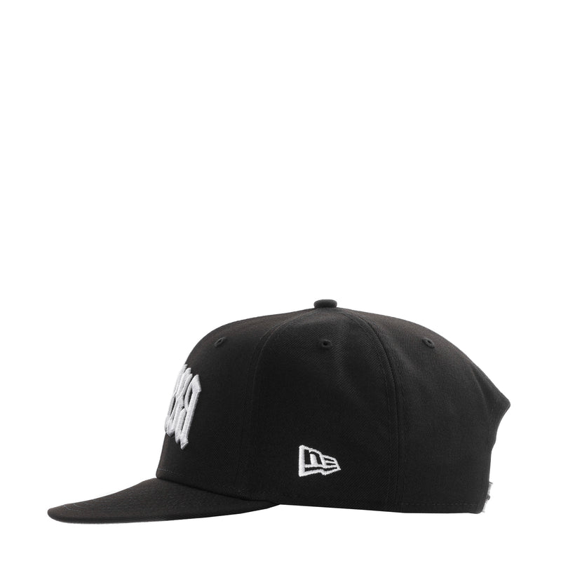 Black baseball cap front with small white New Era flag logo