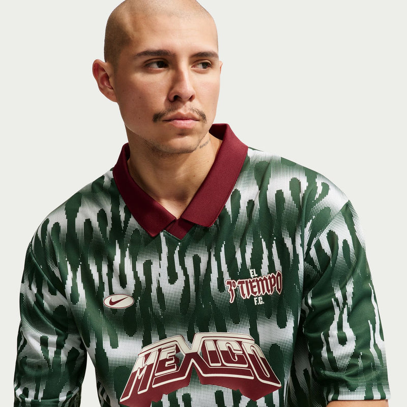Men's Mexico goalie short-sleeve jersey close-up: dark green with red collar and chest logo