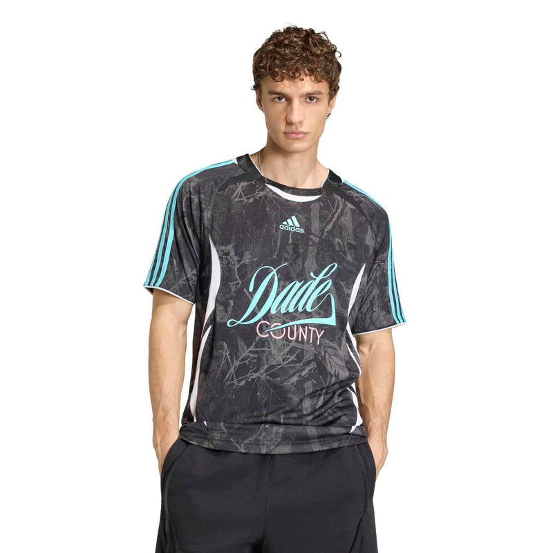 Men's dark athletic jersey on model, teal stripes and 'Dade County' front graphic