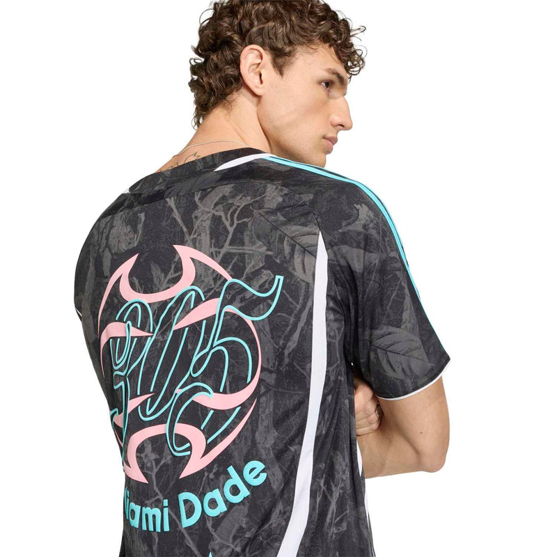 Men's dark jersey back close-up with 'Miami Dade' neon graphic and teal sleeve trim