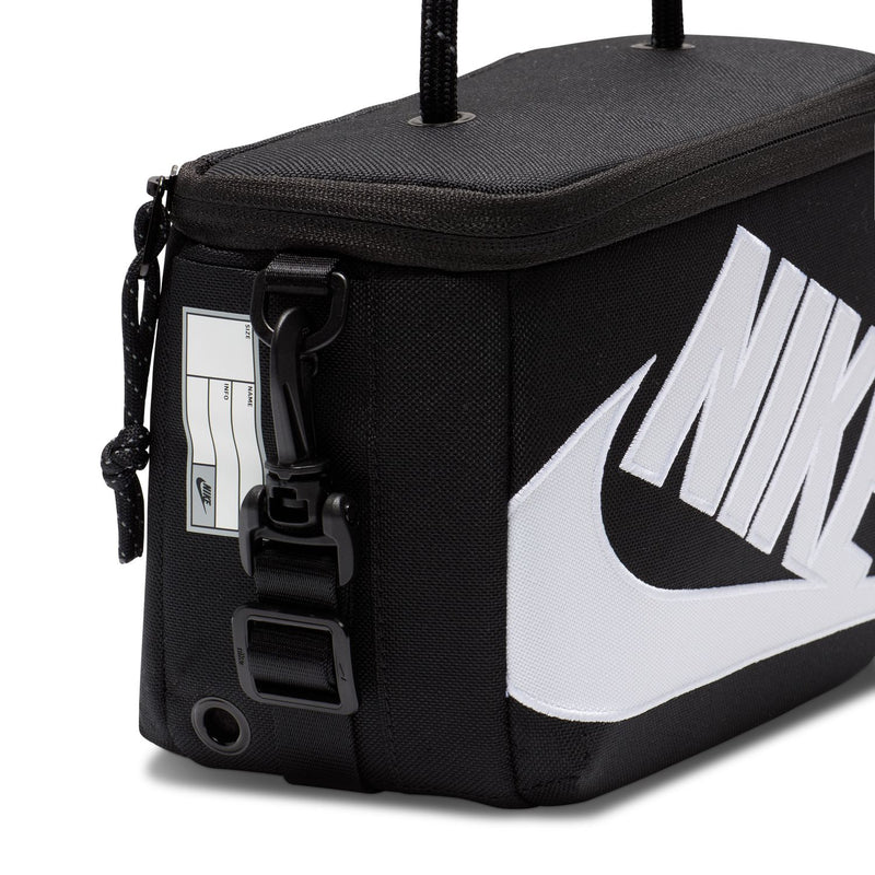 Black mini crossbody bag close-up with white NIKE logo and zipper pull hardware