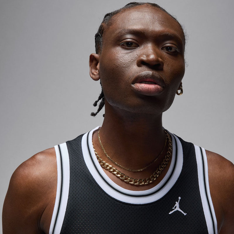 Men's black basketball jersey neckline with white-and-black stripes and small Jordan logo