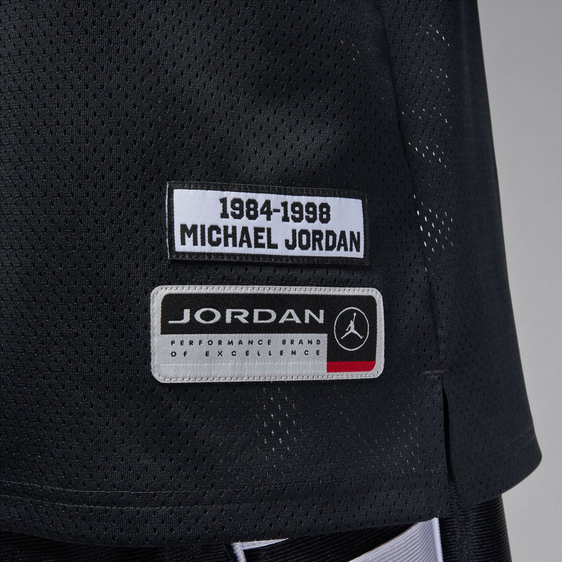 Men's black mesh jersey label: '1984-1998 Michael Jordan' and Jordan performance brand
