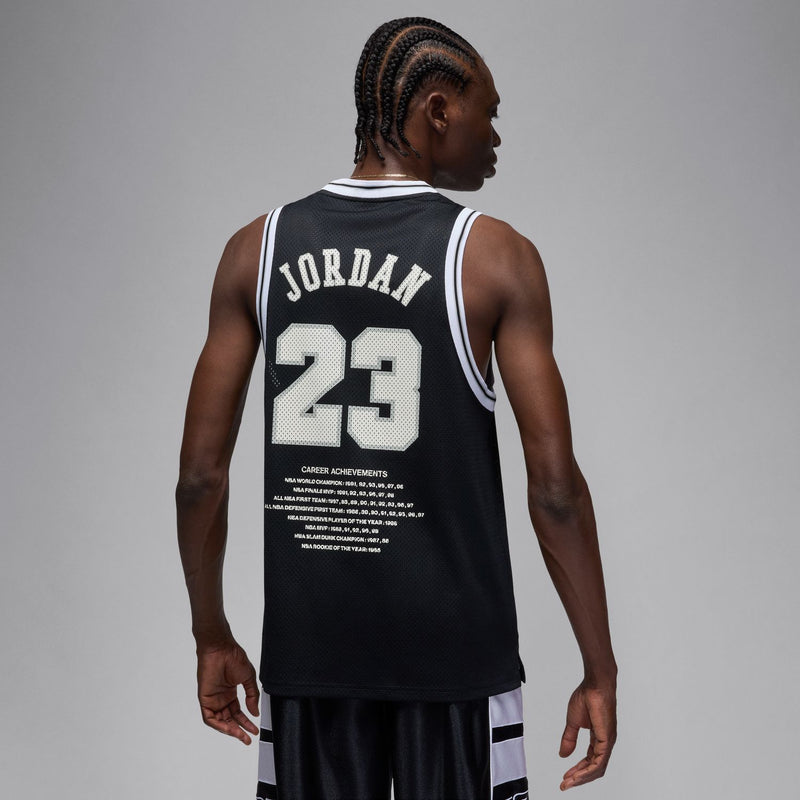 Men's black basketball jersey back view with No. 23 print and Jordan wordmark