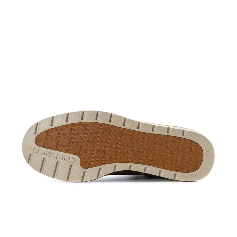 Men's dark brown moc toe boot outsole with treaded rubber and light tan edge