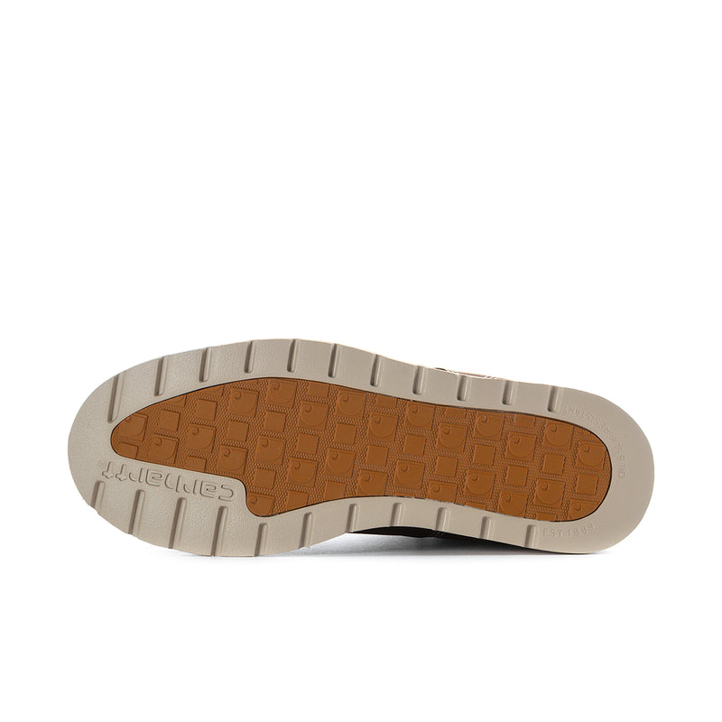 Brown boot outsole tread bottom view with rugged traction pattern