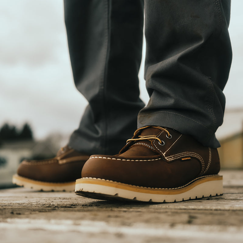 Brown men's 6-inch moc toe waterproof boots with lace-up and thick rubber sole