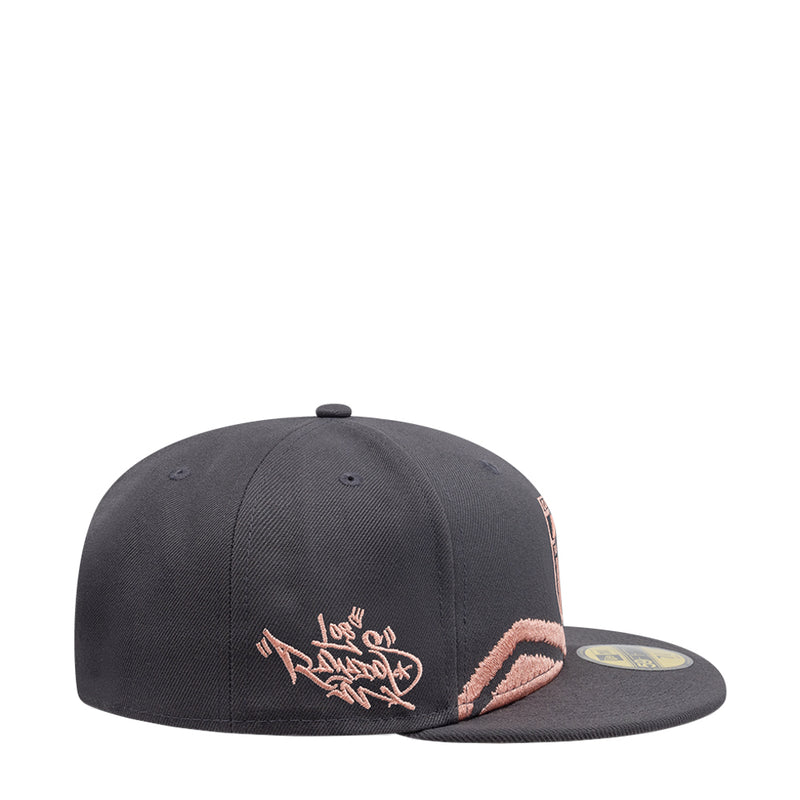 Dark grey snapback cap with embroidered side text and coral mountain design.