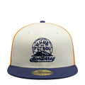 Three-tone baseball cap in white, gold, and navy with embroidered front logo