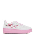 A pair of white platform trainers with pink floral embroidery on the top and a pink sole - Side View