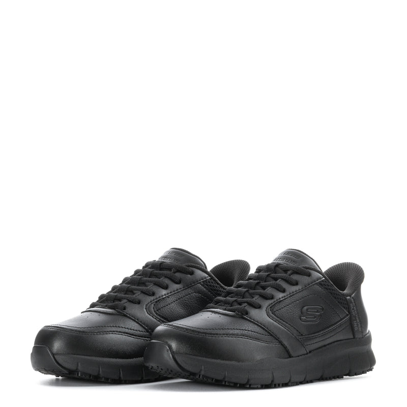 Pair of black low-top lace-up sneakers with textured panels and cushioned footbed