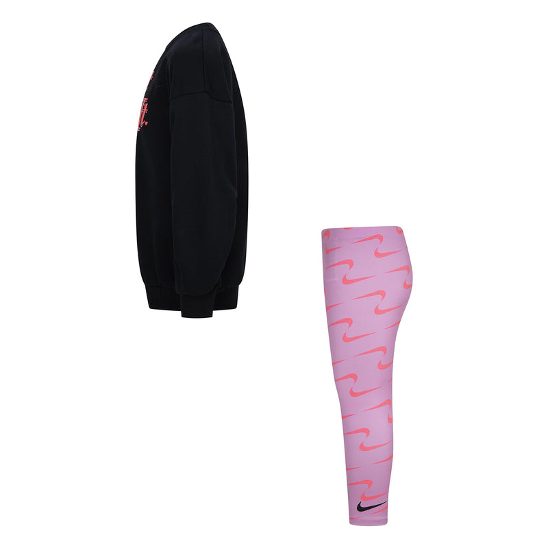 Kids black crew sweatshirt and pink Nike swoosh leggings, side view