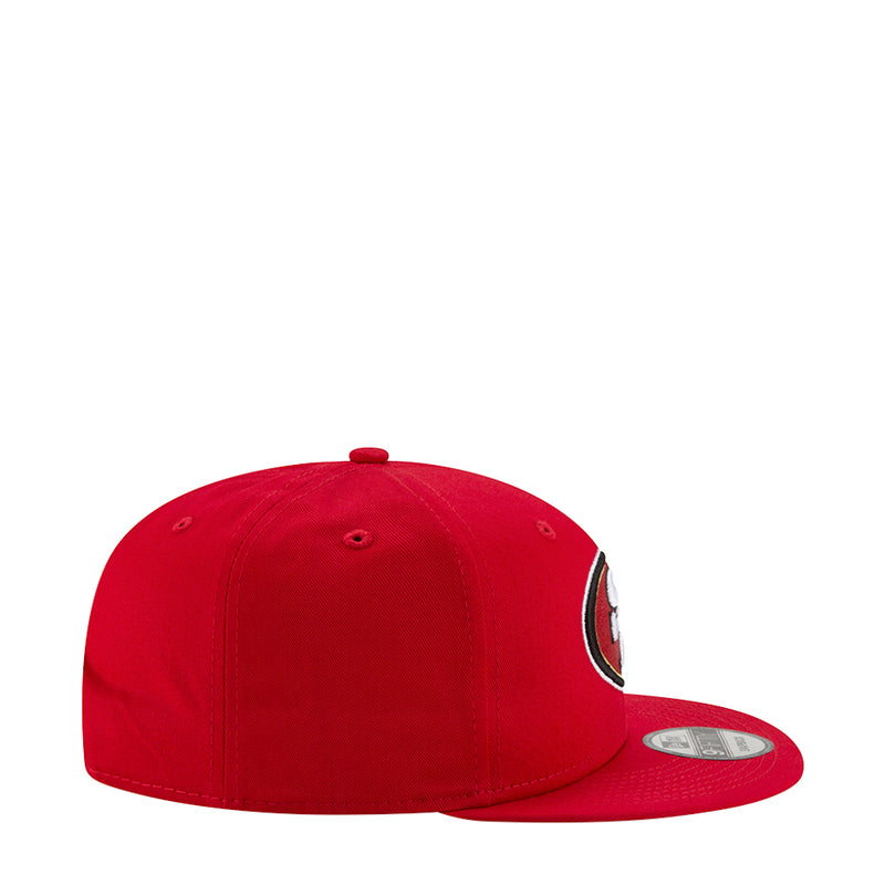 Red baseball cap, side profile with partial SF logo patch