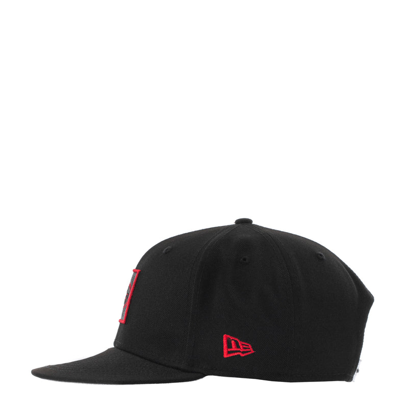 Black baseball cap with red New Era side logo