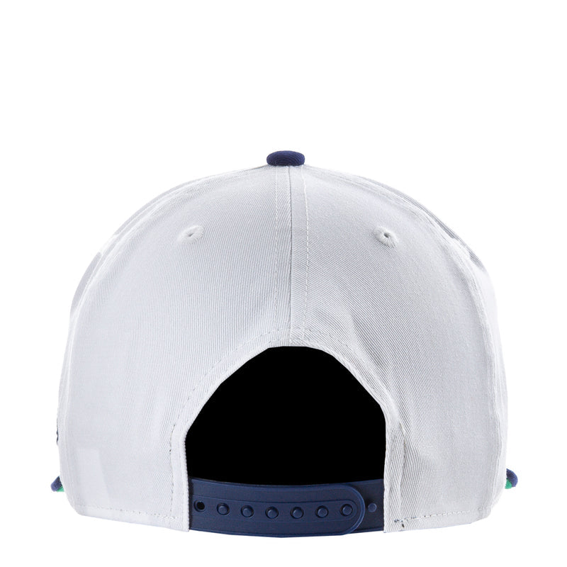 White baseball cap with blue underbrim and open back showing black interior