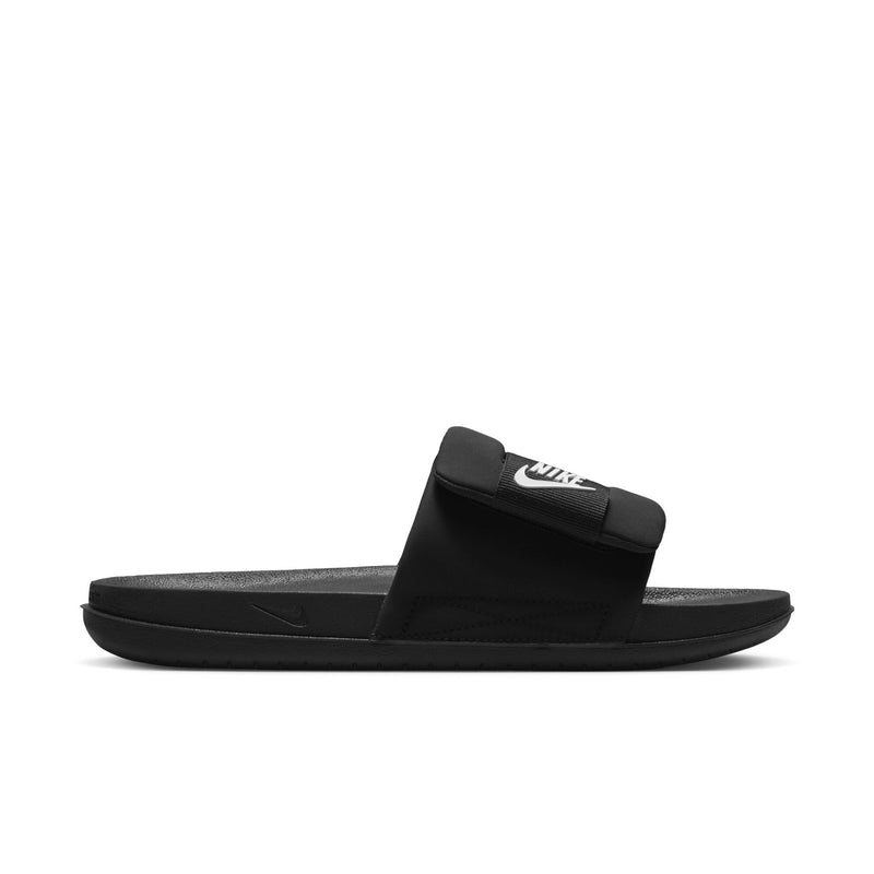 Black slide sandals with cushioned strap and NIKE logo on front