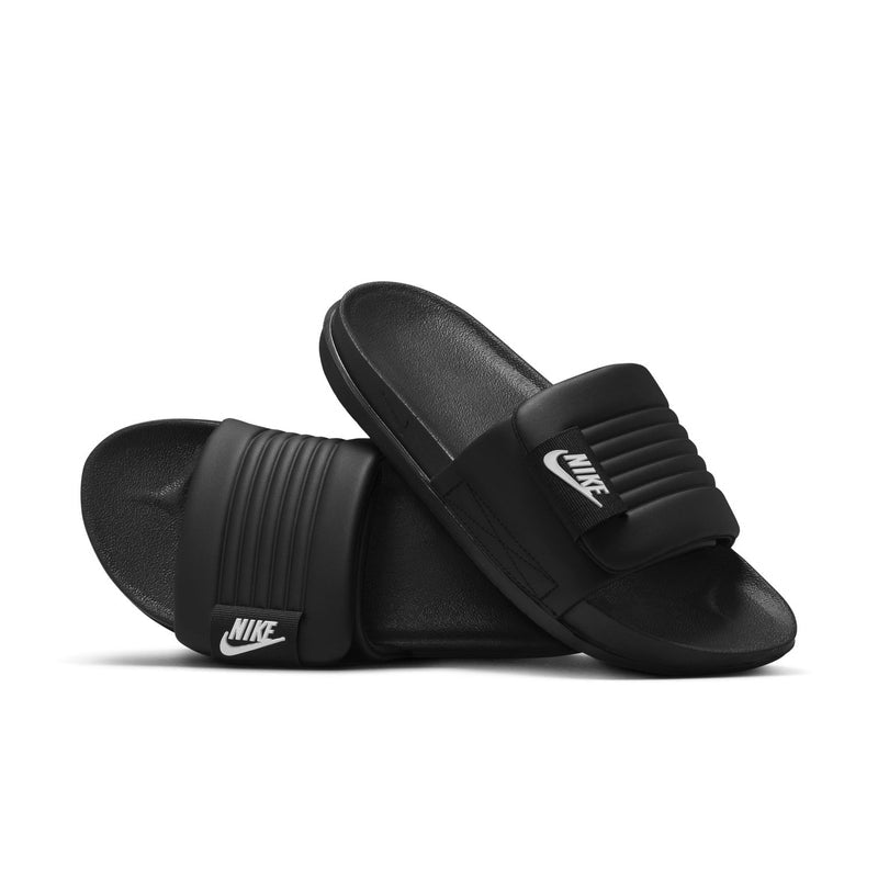 Women’s black slide sandals with ridged strap detail and white Nike branding