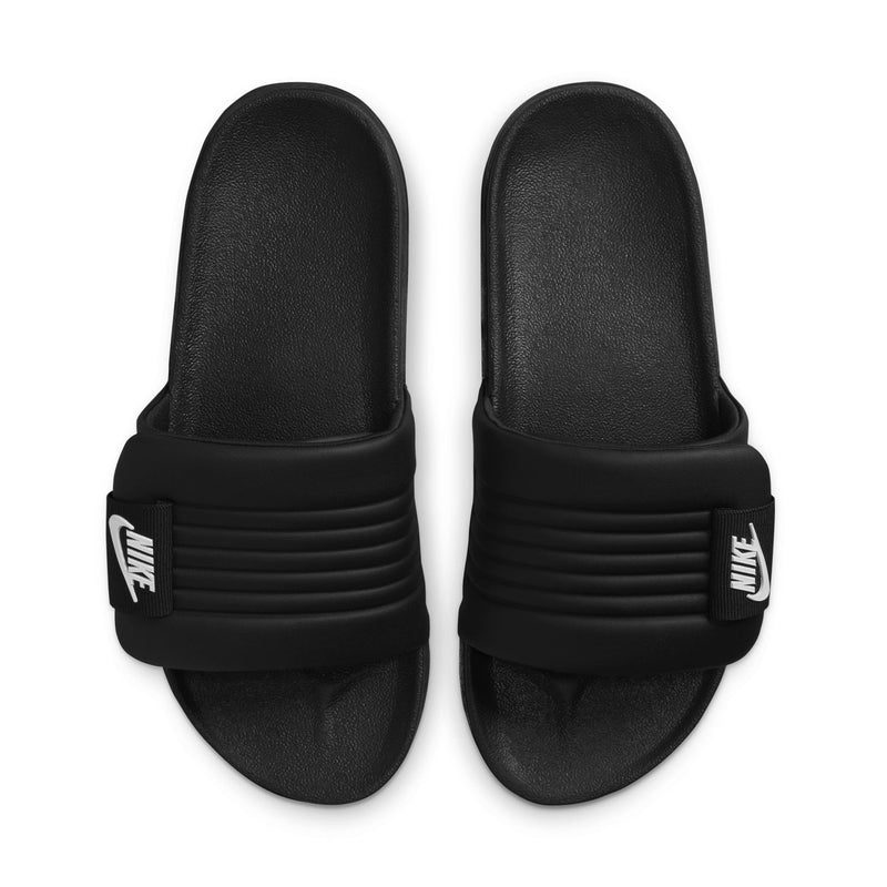 Women’s black slide sandals, pair view, with white Nike logo on the straps