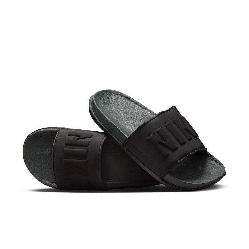 Men's slide sandals with black straps and textured dark gray footbed