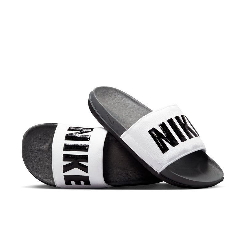 Men's slide sandals with white upper strap, black Nike text, dark grey footbed