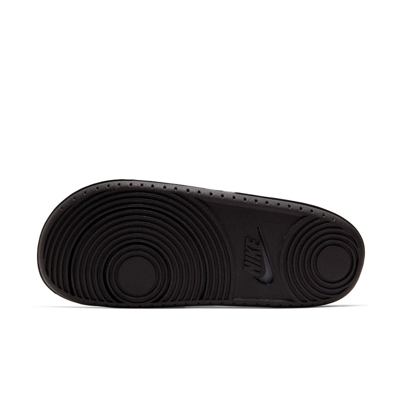 Men's slide sandal outsole in dark grey with textured traction and Nike mark
