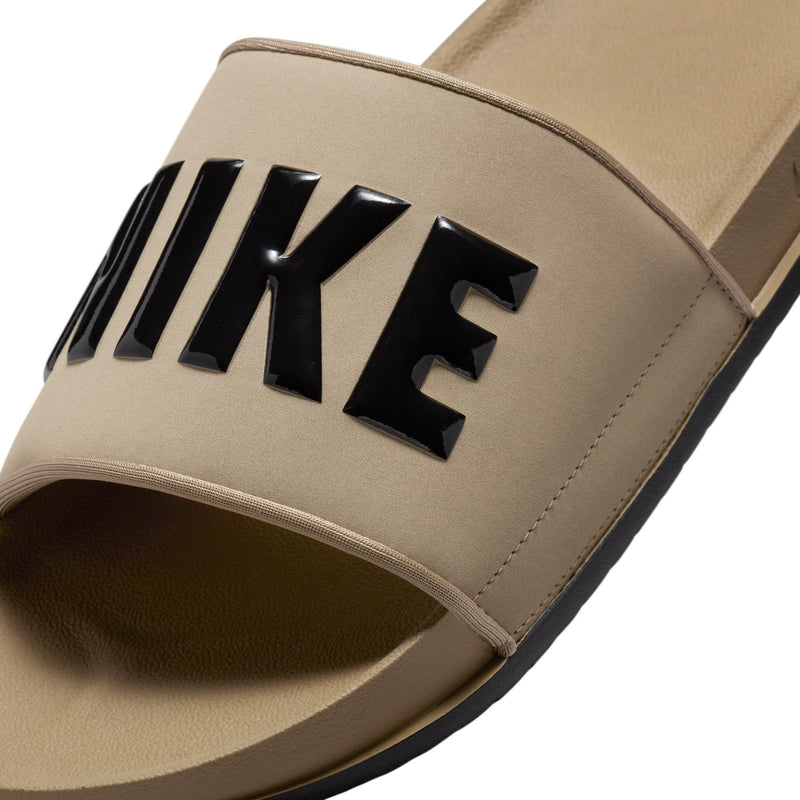 Close-up of men's khaki Nike slide strap with black NIKE lettering