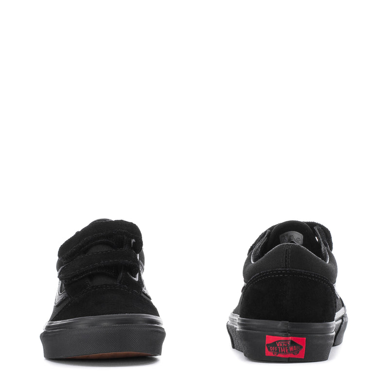 Kids black sneakers rear view with heel tab and red logo detail on the heel