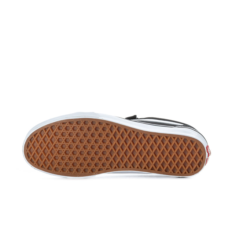 Vans sneaker outsole, tan rubber tread with white edge around the base