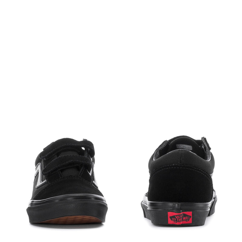 Black skate shoe pair with rear branding patch and padded heel collar