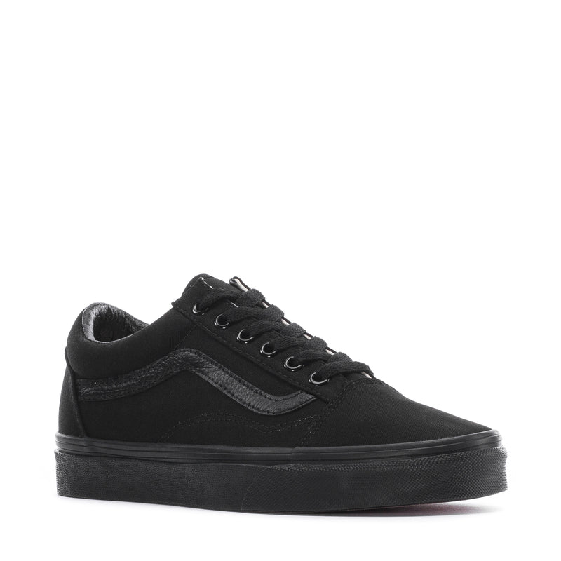 Black youth low-top canvas sneakers, front 3/4 view with lace-up and stripe detail