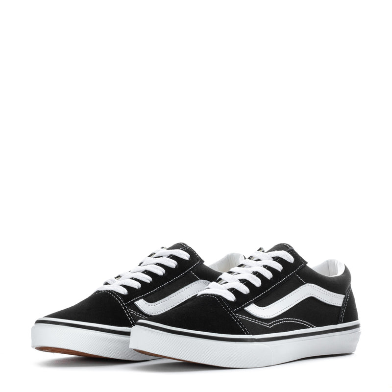 Pair of black youth Vans sneakers with white stripes and lace-up uppers.
