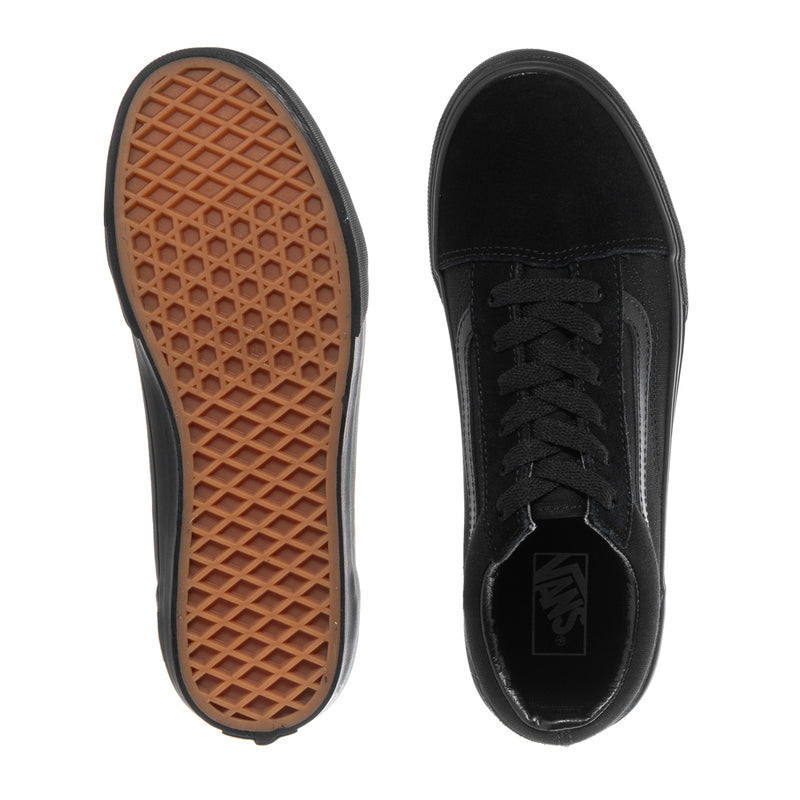 Black youth sneaker outsoles and interior lining with Vans logo