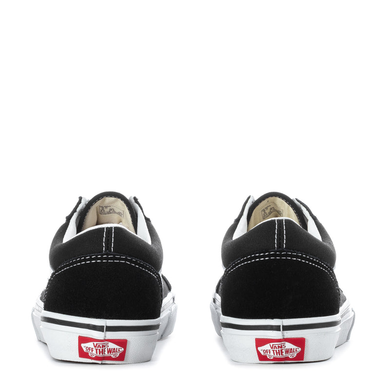 Black Vans youth sneakers, back view with white heel stitching and 'Off the Wall' labels.