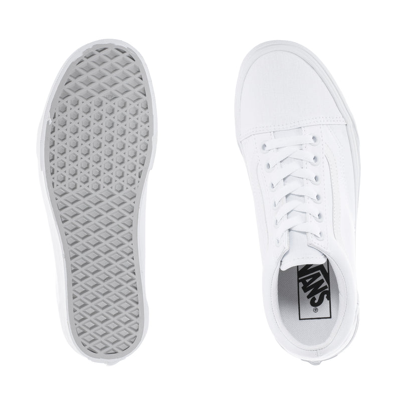 Youth white skate shoe outsole and Vans label on interior side