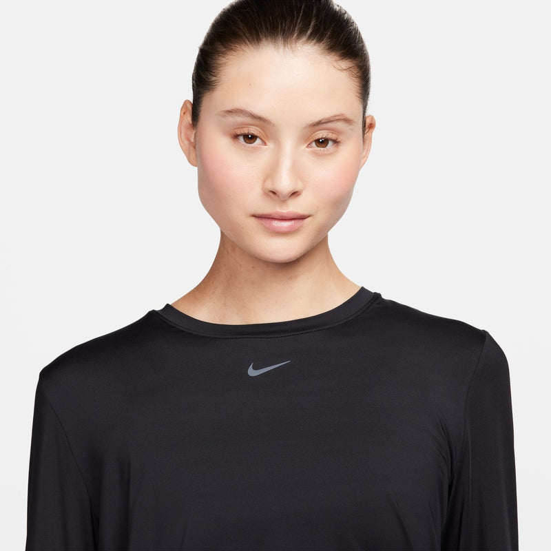 Women's black long-sleeve Dri-FIT top close-up of crew neck and Nike swoosh